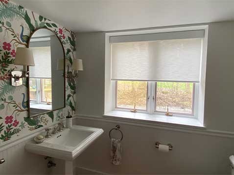 Bathroom with floral wallpaper